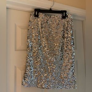 Never worn. Knee length.